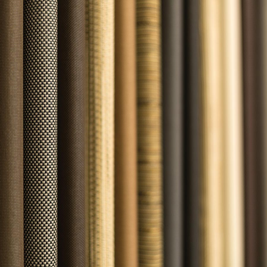 Close-up of vertical fabric swatches in neutral beige and brown tones