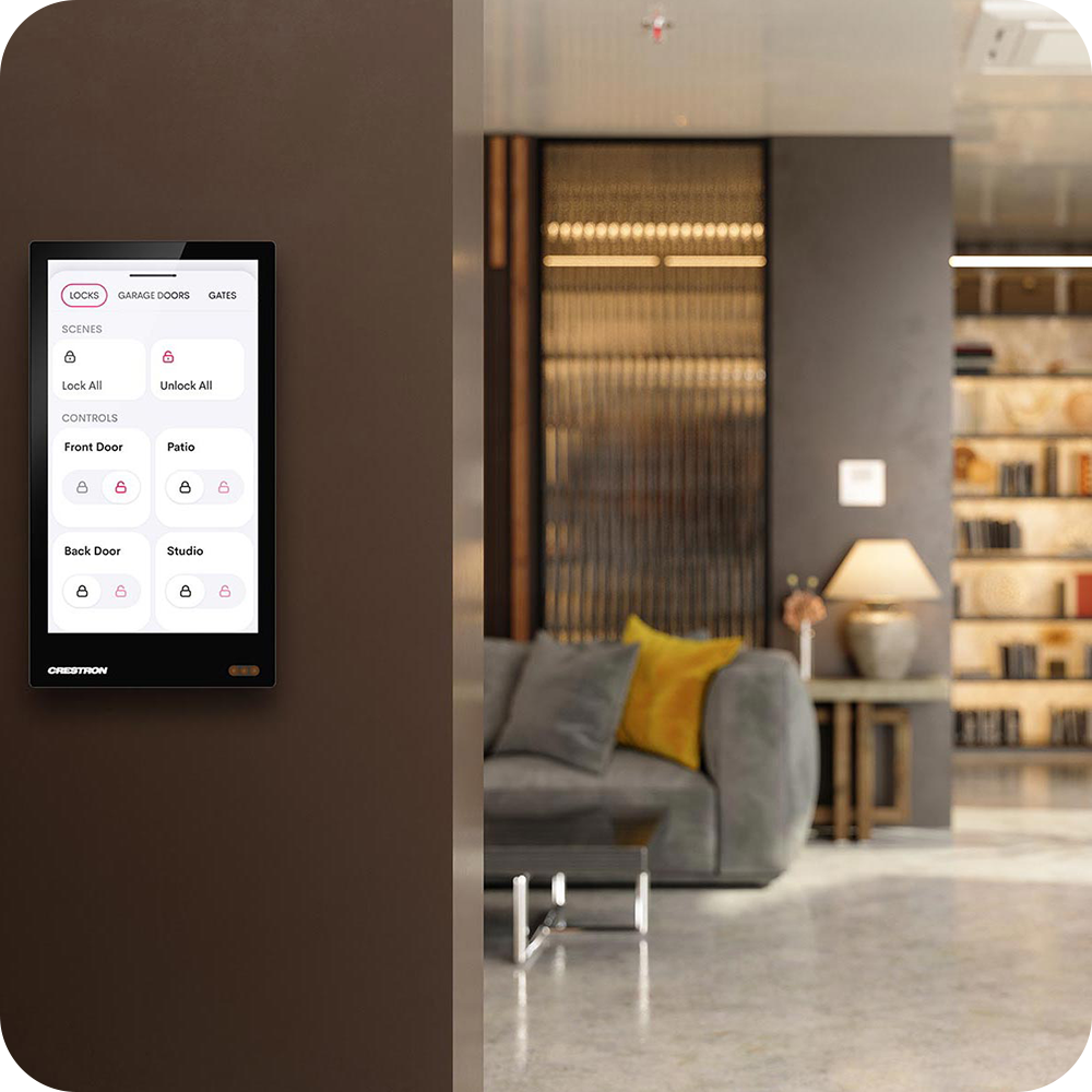 Wall-mounted touch screen displaying home lock controls next to an open living room