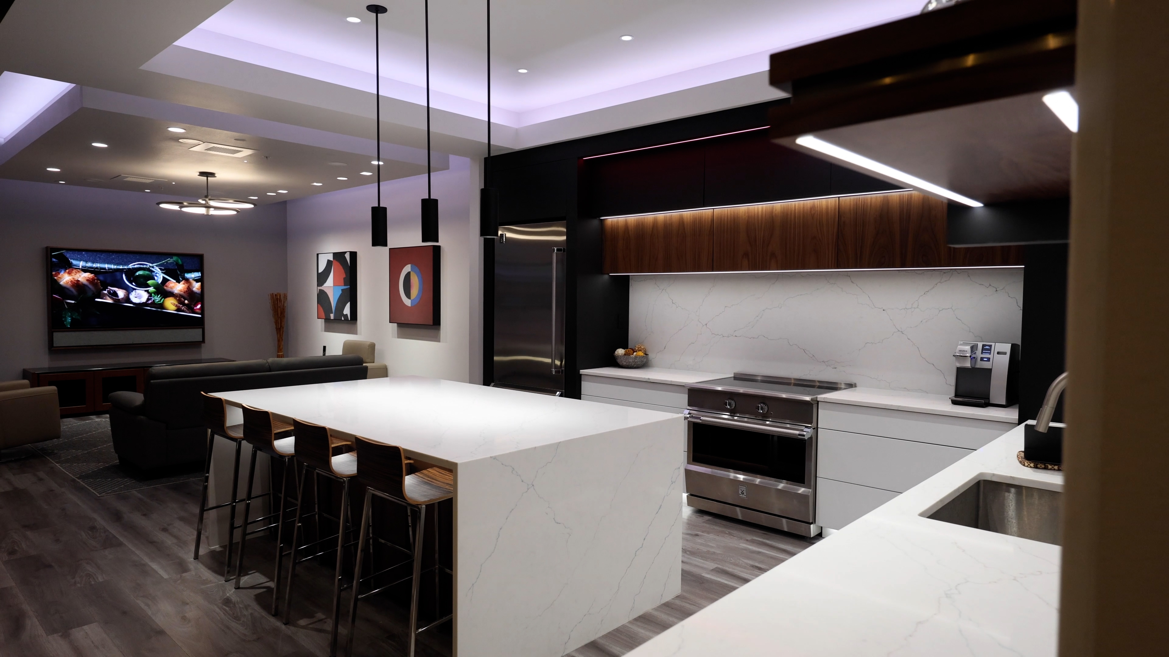 A contemporary kitchen illuminated with ambient lighting and advanced DMF controls, creating a warm atmosphere.