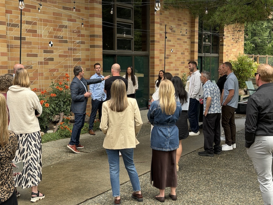 Group of people gathered outside for a Coastal Source demonstration.  Source: Wipliance