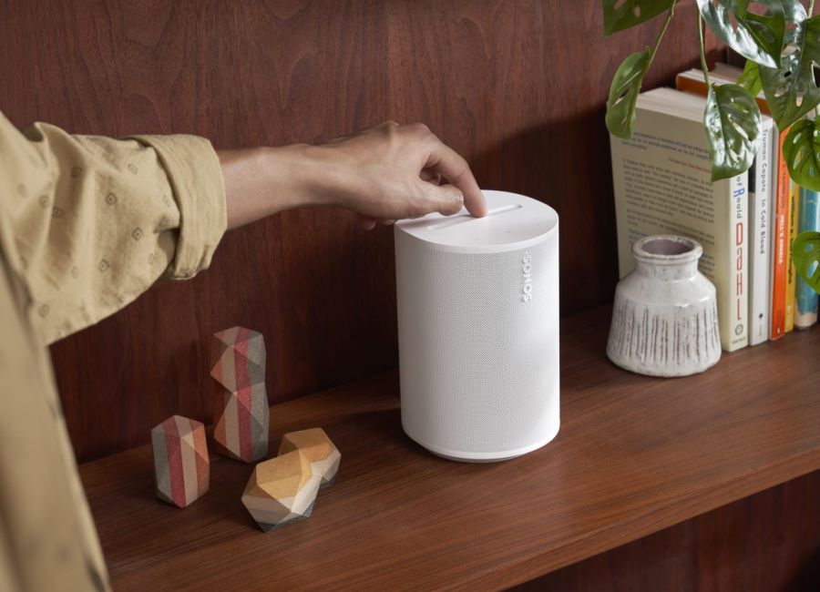 Sonos App in an iPhone on a wood table