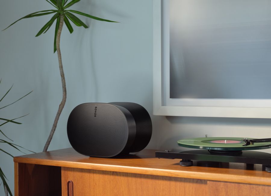 Sonos App in an iPhone on a wood table