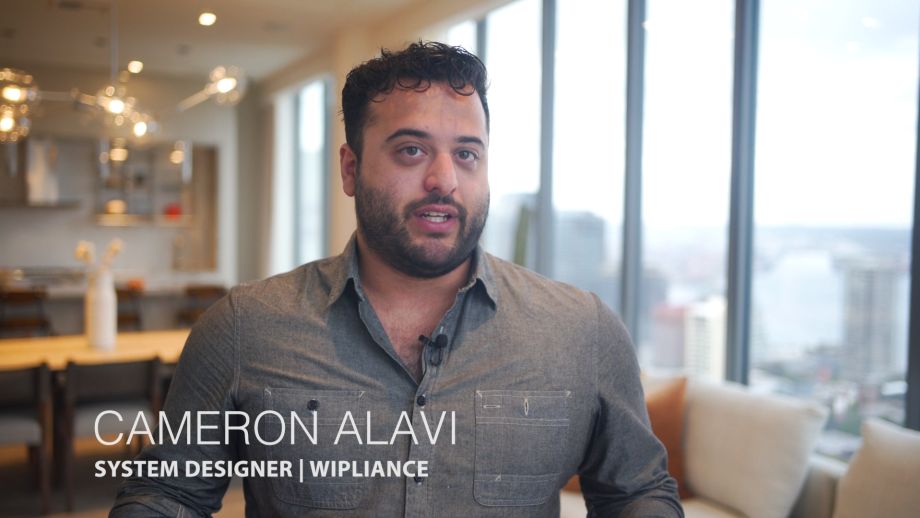 System designer Cameron Alavi from Wipliance discussing smart home technology and system design in a modern Seattle residence.