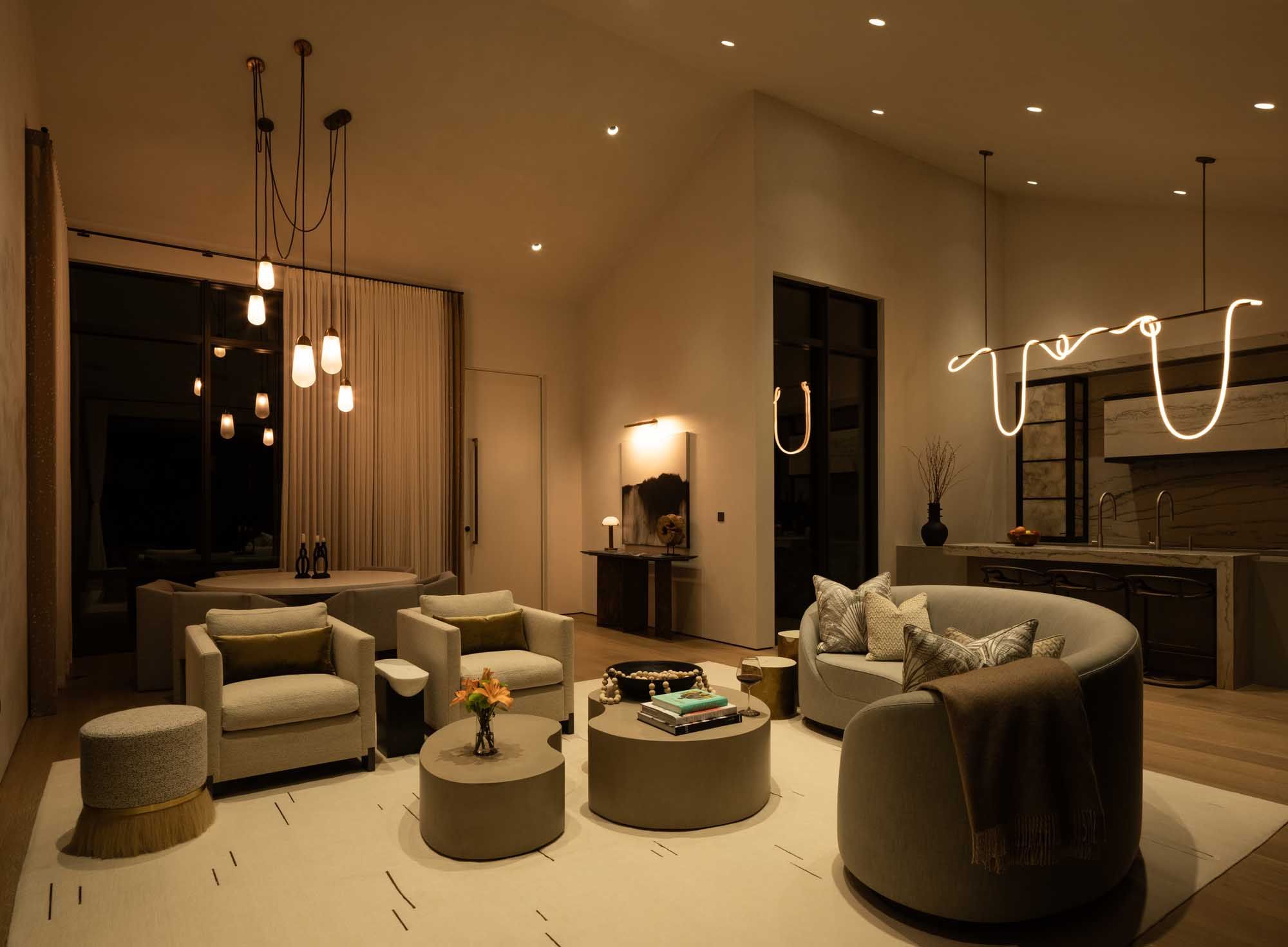 Evening living room scene with soft dimmed lights and neutral furnishings