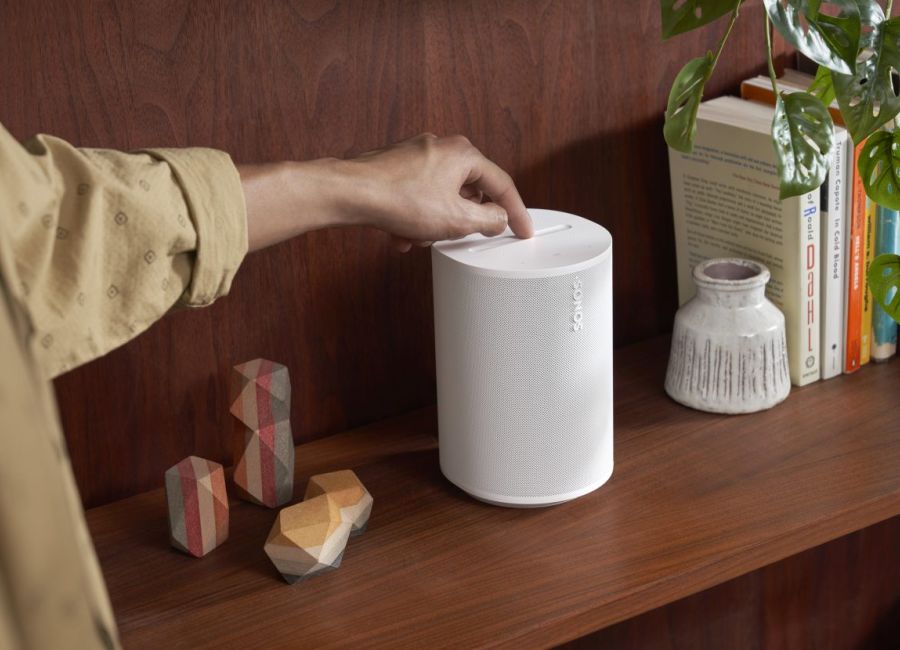 Sonos App in an iPhone on a wood table