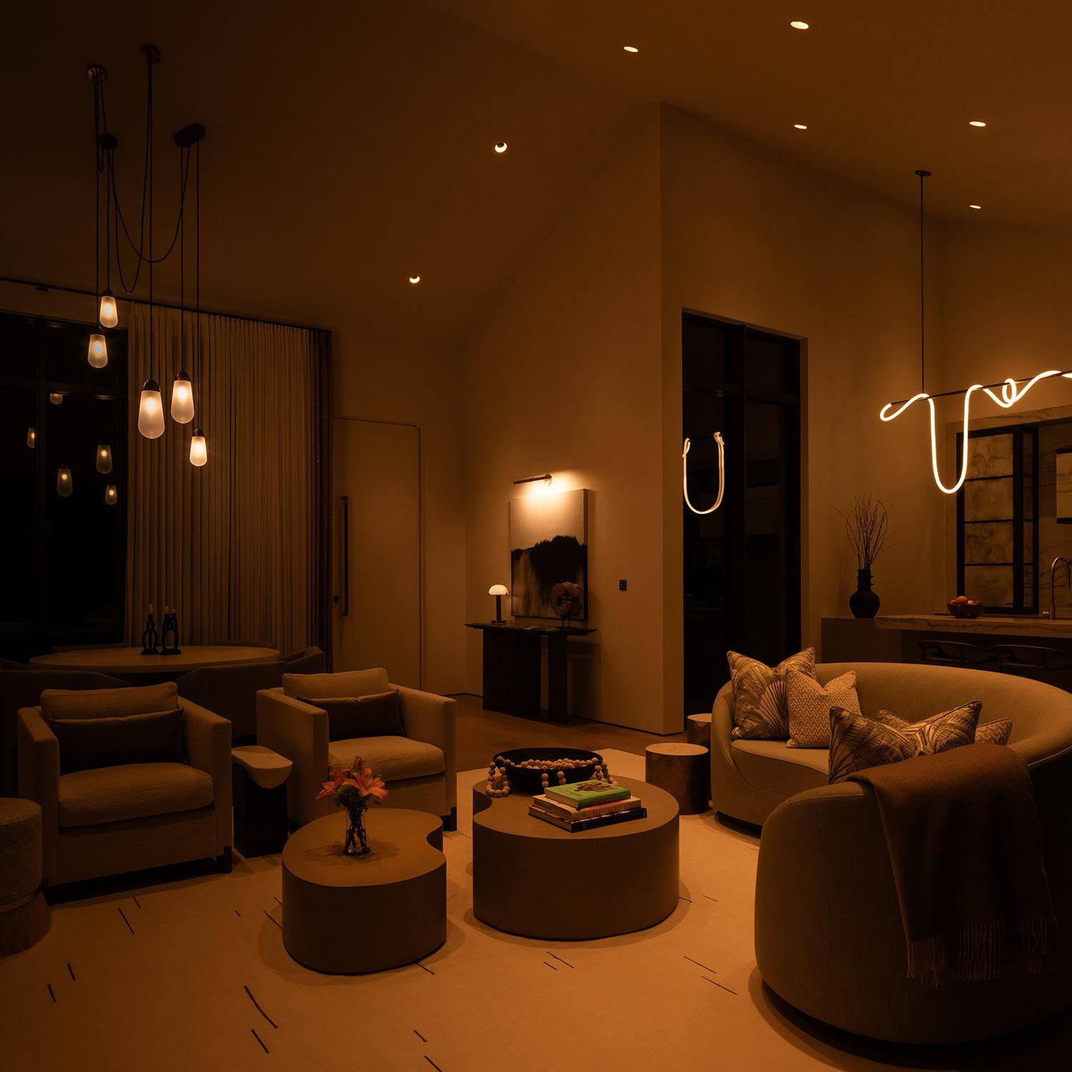 dim living room with glowing pendant lights and rounded furniture silhouettes
